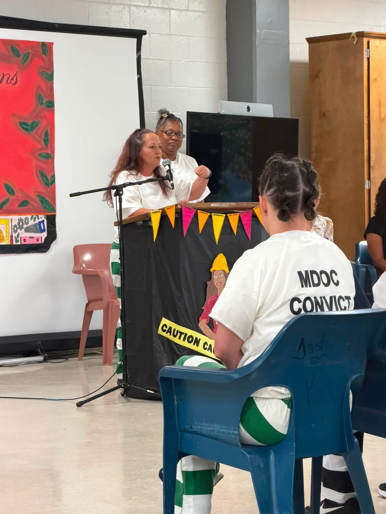 A graduate speaking at a Pathways to Success ceremony at CMCF